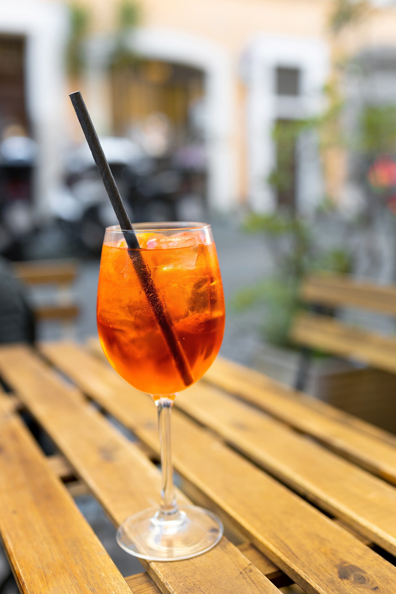 Black Paper Straw sitting in a Refreshing iced Drink