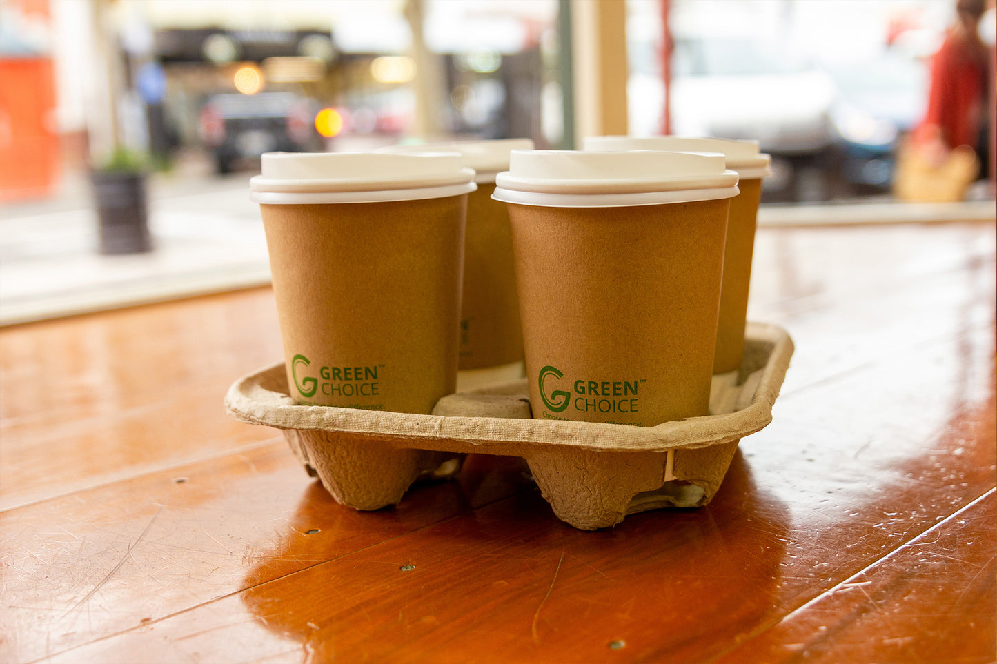 4 Coffees ready to go in a 4 Compartment Pulp Cardboard Cup Holder in a Cafe