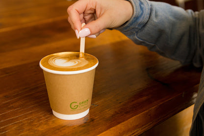 Flat White being stirred  by a Wooden Disposable Stir Stick 